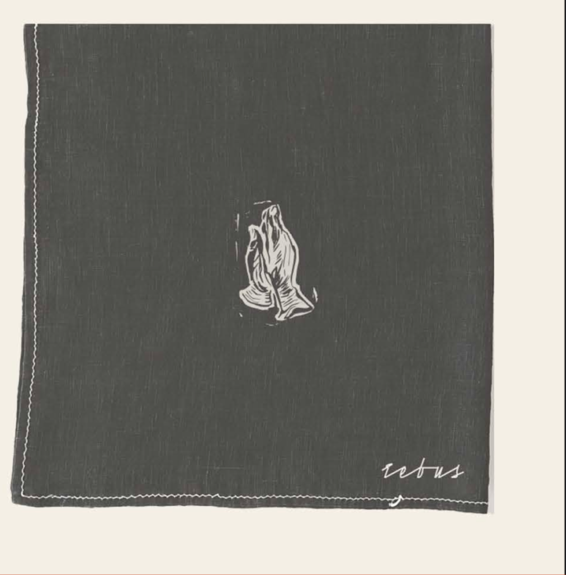 Rebus branding printed on a cafe napkin